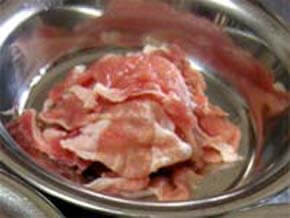 Cut slices of pork into bite-size chunks